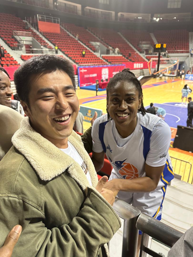 George Wang courtside at a basketball event in Shanghai